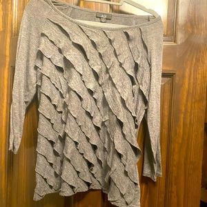 Grey long sleeve shirt with ruffle front.